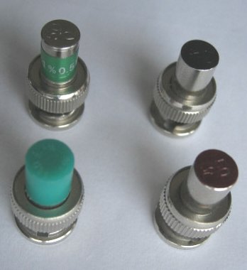[Photograph of four locally obtained BNC loads]