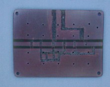 [Photograph of PCB with copper trimmed]
