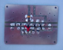 [Photograph of PCB with components mounted]