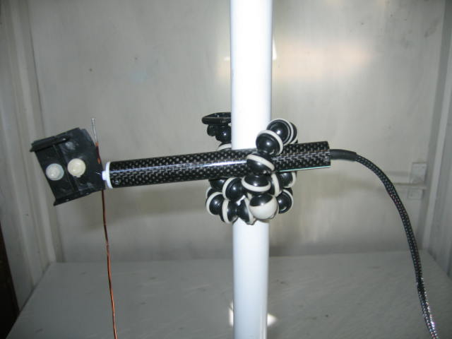 [Photograph of test probe and antenna]